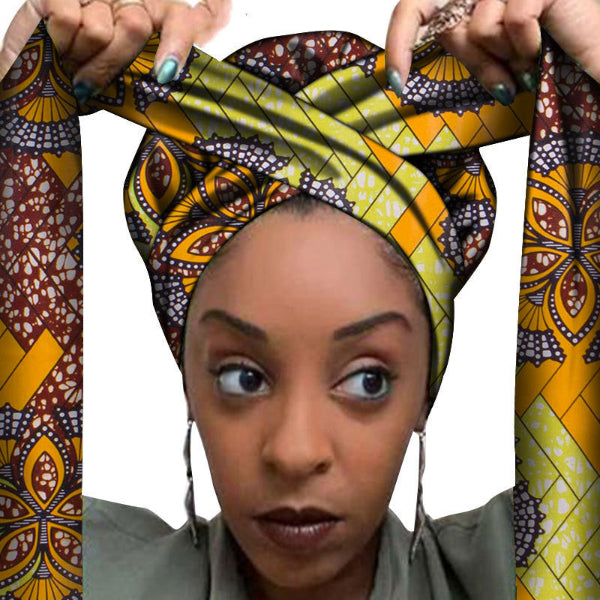Woman wearing a colorful patterned headscarf with a white background
