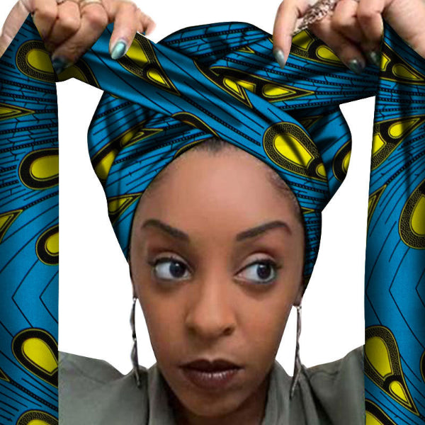 Woman wearing a blue and yellow patterned headscarf with a white background