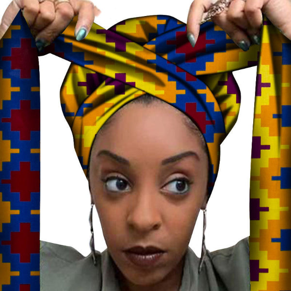 Woman wearing a colorful patterned headscarf with geometric design