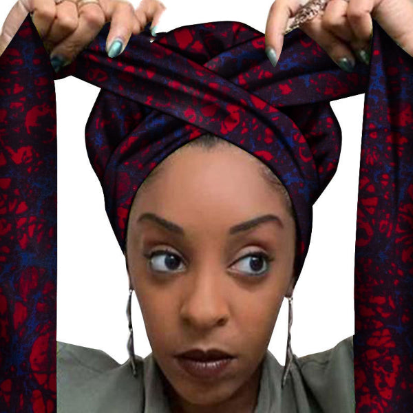 Woman wearing a red and blue patterned headscarf with a white background