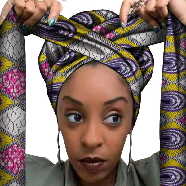 Woman wearing a colorful patterned headscarf with a white background