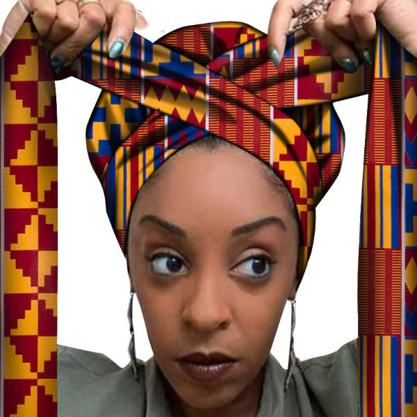 Woman wearing a colorful patterned headscarf with a white background