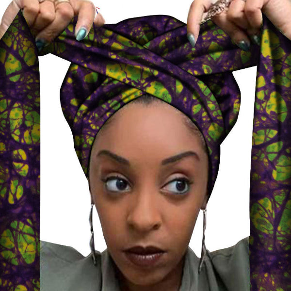Woman wearing a colorful headscarf with a white background