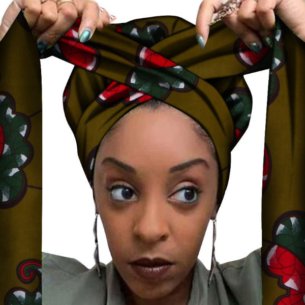 Woman wearing a decorative headscarf with intricate patterns