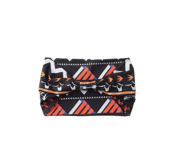 Patterned headband with orange, blue, and white design on a white background