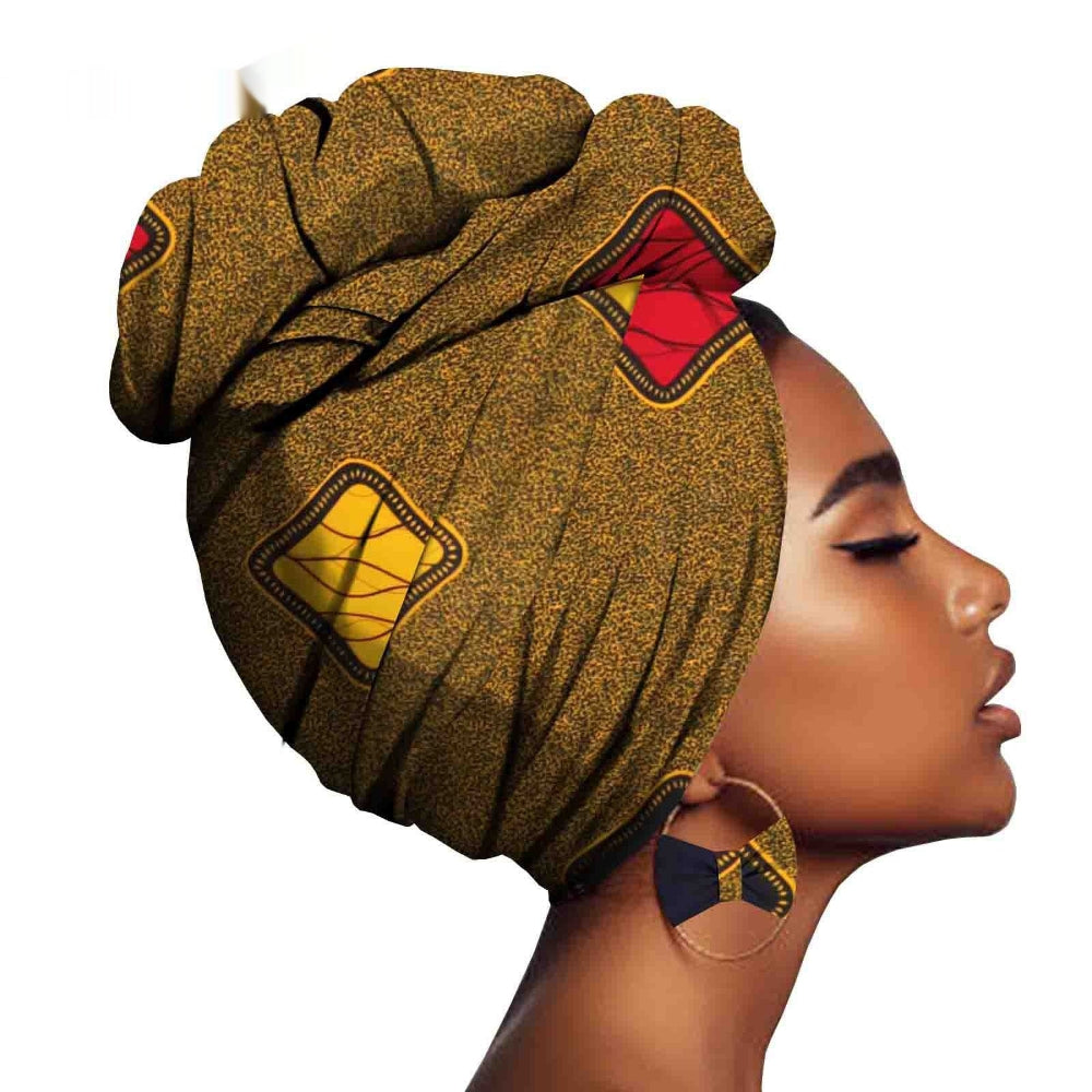 Woman wearing a decorative headwrap with geometric patterns on a white background