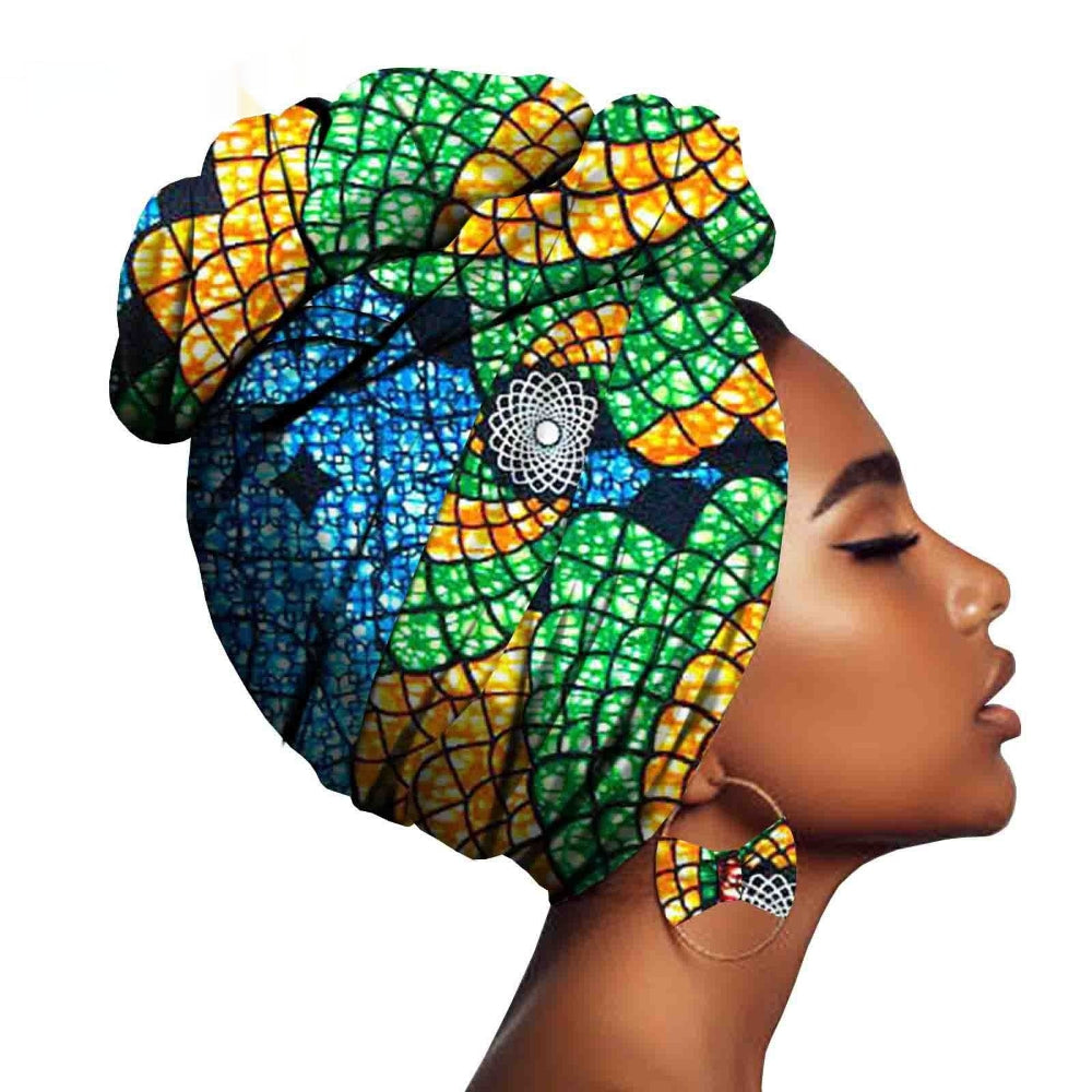 Woman wearing a colorful headscarf with intricate patterns on a white background